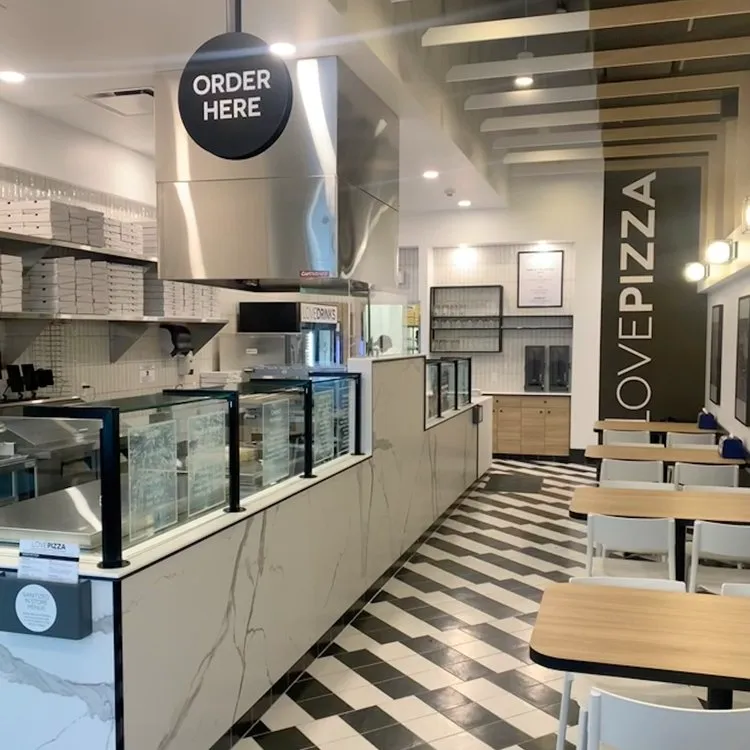 Fresh pizza being prepared