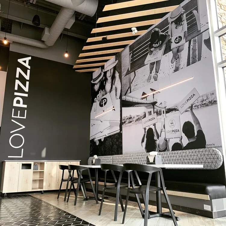 LOVEPIZZA team serving customers